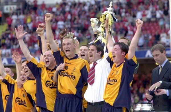 Liverpool's injured club captain Jamie Redknapp lifts the FA Cup with Robbie Fowler (right) and the rest of the team after victory over Arsenal in today's FA Cup Final at the Millennium Stadium, Cardiff. The cup was presented by the Duke of York. (Picture by David Jones PA Archive/PA Image)