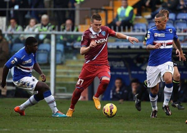 Empoli midfielder Piotr Zielinski, center, runs with the ball between Sampdoria midfielder Alfred Joseph Duncan, left, and defender Angelo Palombo during a Serie A soccer match between Sampdoria and Empoli, in Genoa, Italy, Sunday, Jan. 11, 2015. (AP Photo/Carlo Baroncini)