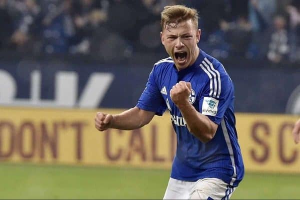 Schalke's Max Meyer, left, celebrates beside Berlin's Sebastian Langkamp after scoring the decisive goal in the very last minute of the German Bundesliga soccer match between FC Schalke 04 and Hertha BSC Berlin in Gelsenkirchen, Germany, Saturday, Oct. 17, 2015. Schalke defeated Berlin with 2-1. (AP Photo/Martin Meissner)