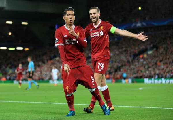 Liverpool's Roberto Firmino celebrates scoring his side's fourth goal of the game with team mate Liverpool's Jordan Henderson