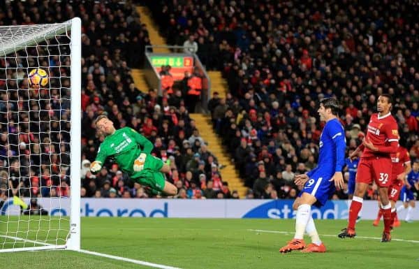 Liverpool goalkeeper Simon Mignolet dives in vain as Chelsea's Willian (hidden) scores his side's first goal during the Premier League match at Anfield, Liverpool.