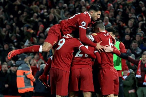 Liverpool's Sadio Mane (obscured) celebrates with team-mates including Liverpool's Emre Can (top) after scoring his side's third goal during the Premier League match at Anfield, Liverpool.