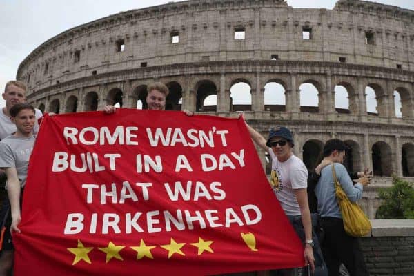 Liverpool FC fans (left to right) Josh Mitchell, James Beattie and Adam Beattie, hold up a banner in front of the Colosseum in Rome ahead of the UEFA Champions League, Semi Final Second Leg match at the Stadio Olimpico against AS Roma on Wednesday.