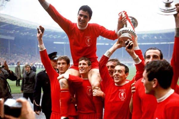 Liverpool captain Ron Yeats (top) holds onto the FA Cup as he is hoisted aloft by his jubilant teammates after their 2-1 win: (l-r) Geoff Strong, Yeats, Wilf Stevenson, Peter Thompson, Ian St John, Gerry Byrne, Ian Callaghan - PA Photos/PA Archive/PA Images