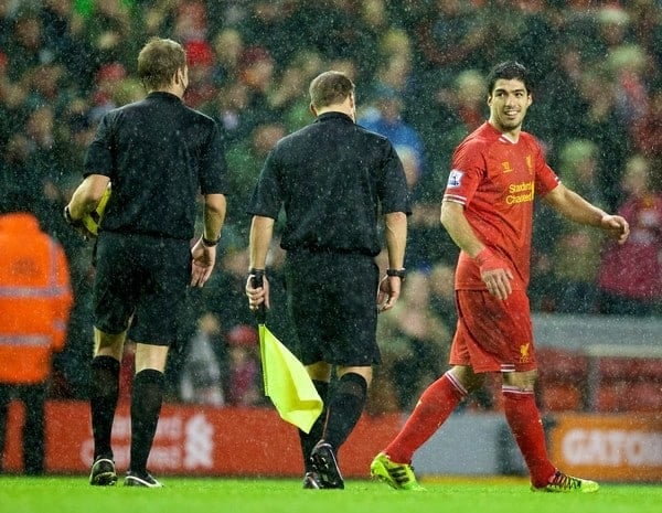 LIVERPOOL, ENGLAND - Wednesday, January 1, 2014: Liverpool's Luis Suarez talks to referee Craig Pawson after the 2-0 victory over Hull City during the Premiership match at Anfield. (Pic by David Rawcliffe/Propaganda)