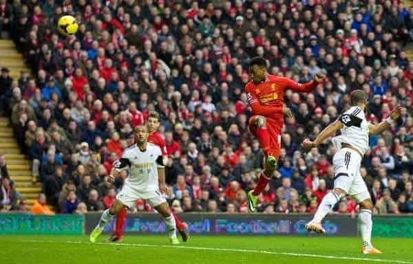 LIVERPOOL, ENGLAND - Sunday, February 23, 2014: Liverpool's Daniel Sturridge scores the third goal against Swansea City during the Premiership match at Anfield. (Pic by David Rawcliffe/Propaganda)