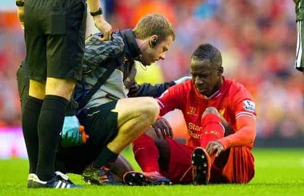 LIVERPOOL, ENGLAND - Tuesday, August 27, 2013: Liverpool's Aly Cissokho leaves the field injured just ten minutes into his full debut: the Football League Cup 2nd Round match against Notts County at Anfield. (Pic by David Rawcliffe/Propaganda)