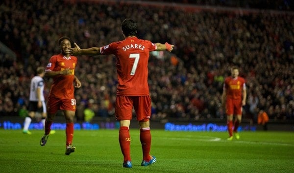 LIVERPOOL, ENGLAND - Wednesday, December 4, 2013: Liverpool's Luis Suarez celebrating Raheem Sterling's first and Liverpool's fifth goal against Norwich City during the Premiership match at Anfield. (Pic by David Rawcliffe/Propaganda)