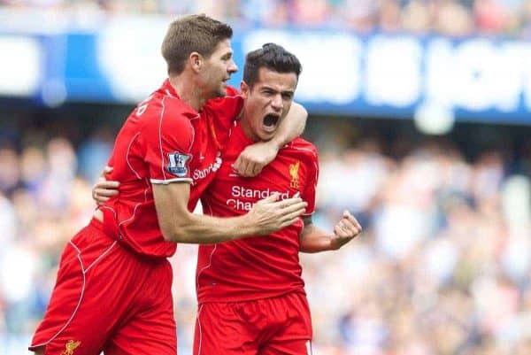 LONDON, ENGLAND - Sunday, October 19, 2014: Liverpool's Philippe Coutinho Correia celebrates scoring the second goal against Queens Park Rangers with team-mate captain Steven Gerrard during the Premier League match at Loftus Road. (Pic by David Rawcliffe/Propaganda)