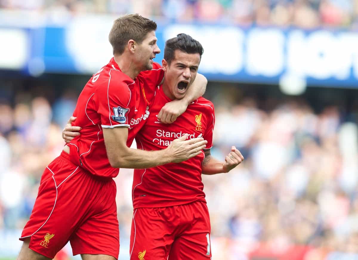 LONDON, ENGLAND - Sunday, October 19, 2014: Liverpool's Philippe Coutinho Correia celebrates scoring the second goal against Queens Park Rangers with team-mate captain Steven Gerrard during the Premier League match at Loftus Road. (Pic by David Rawcliffe/Propaganda)