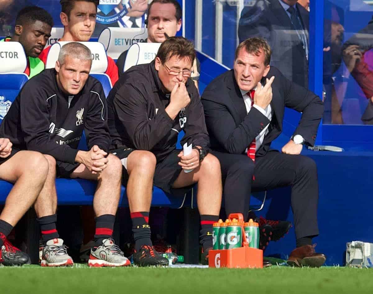 LONDON, ENGLAND - Sunday, October 19, 2014: Liverpool's manager Brendan Rodgers, assistant manager Colin Pascoe and first team coach Mike Marsh on the bench during the Premier League match against Queens Park Rangers at Loftus Road. (Pic by David Rawcliffe/Propaganda)