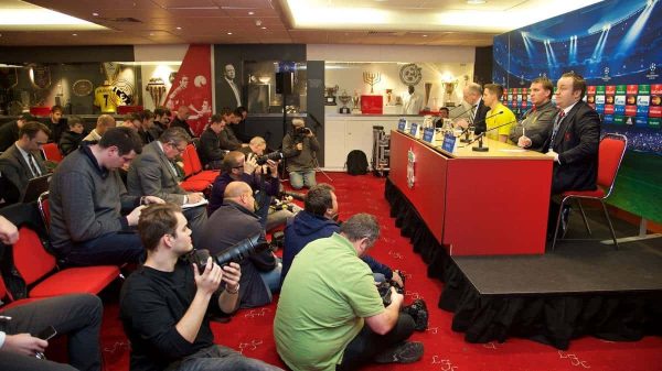 LIVERPOOL, ENGLAND - Monday, December 8, 2014: Liverpool's manager Brendan Rodgers and Joe Allen during a press conference at Anfield ahead of the final UEFA Champions League Group B match against FC Basel. (Pic by David Rawcliffe/Propaganda)