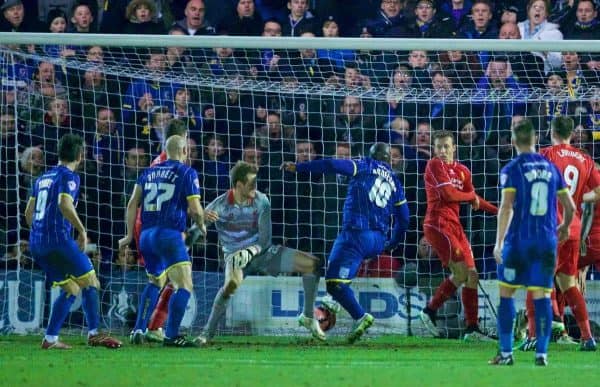 KINGSTON-UPON-THAMES, ENGLAND - Monday, January 5, 2015: AFC Wimbledon's Adebayo Akinfenwa scores the first goal against Liverpool during the FA Cup 3rd Round match at the Kingsmeadow Stadium. (Pic by David Rawcliffe/Propaganda)