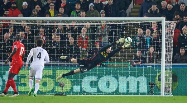 SWANSEA, ENGLAND - Monday, March 16, 2015: Liverpool's goalkeeper Simon Mignolet makes a save against Swansea City during the Premier League match at the Liberty Stadium. (Pic by David Rawcliffe/Propaganda)