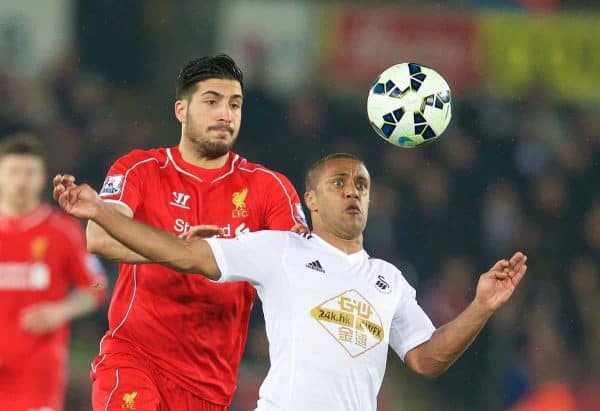 SWANSEA, ENGLAND - Monday, March 16, 2015: Liverpool's Emre Can in action against Swansea City's Wayne Routledge during the Premier League match at the Liberty Stadium. (Pic by David Rawcliffe/Propaganda)