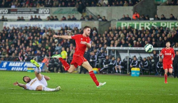 SWANSEA, ENGLAND - Monday, March 16, 2015: Liverpool's captain Jordan Henderson scores the first goal against Swansea City during the Premier League match at the Liberty Stadium. (Pic by David Rawcliffe/Propaganda)