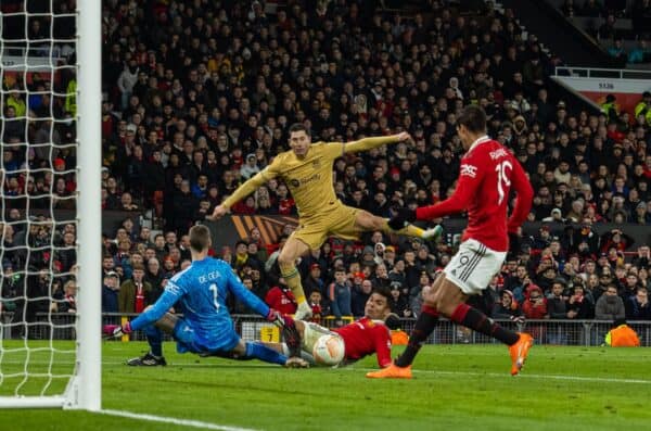 MANCHESTER, ENGLAND - Thursday, February 23, 2023: Manchester United's Raphaël Varane clears the ball after a shot from Barcelona's Robert Lewandowski during the UEFA Europa League Play-Off 2nd Leg game between Manchester United FC and FC Barcelona at Old Trafford. (Pic by David Rawcliffe/Propaganda)