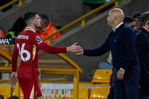 WOLVERHAMPTON, ENGLAND - Saturday, September 28, 2024: Liverpool's Andy Robertson shakes hands with head coach Arne Slot as he is substituted during the FA Premier League match between Wolverhampton Wanderers FC and Liverpool FC at Molineux Stadium. (Photo by David Rawcliffe/Propaganda)