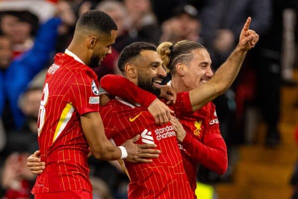 LIVERPOOL, ENGLAND - Wednesday, October 2, 2024: Liverpool's Mohamed Salah celebrates with team-mates Cody Gakpo (L) and Kostas Tsimikas (R) after scoring the second goal during the UEFA Champions League game between Liverpool FC and Bologna FC 1909 at Anfield. (Photo by David Rawcliffe/Propaganda)