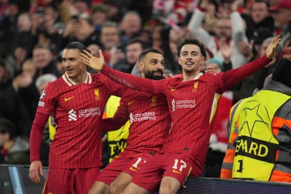 Mohamed Salah celebrates with his teammates Darwin Nunez and Curtis Jones after scoring his side's first goal during the Champions League, opening phase soccer match between Liverpool and Lille at Anfield Stadium, Liverpool, England, Tuesday, Jan.21, 2025. (AP Photo/Jon Super)