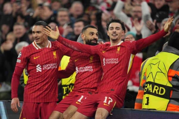 Mohamed Salah celebrates with his teammates Darwin Nunez and Curtis Jones after scoring his side's first goal during the Champions League, opening phase soccer match between Liverpool and Lille at Anfield Stadium, Liverpool, England, Tuesday, Jan.21, 2025. (AP Photo/Jon Super)