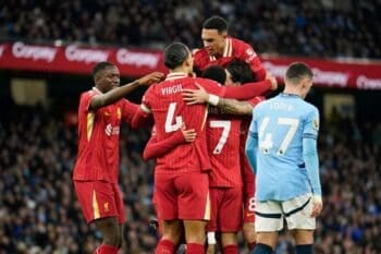 Liverpool’s Mohamed Salah is congratulated after scoring his side’s opening goal during the English Premier League soccer match between Manchester City and Liverpool at Etihad stadium in Manchester, England, Sunday, Feb. 23, 2025. (AP Photo/Dave Thompson)