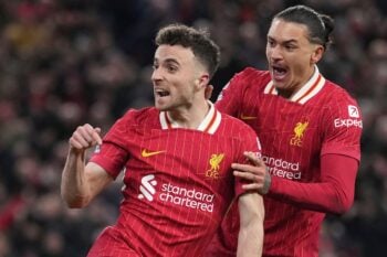 Liverpool’s Diogo Jota, left, celebrates with Liverpool’s Darwin Nunez after scoring his side’s second goal during the English Premier League soccer match between Liverpool and Fulham, at Anfield stadium in Liverpool, England, Saturday, Dec. 14, 2024. (AP