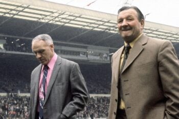 Liverpool manager Bill Shankly  walks on to the pitch accompanied by Bob Paisley at Wembley Stadium for the 1974 FA Cup Final match against Newcastle United.  4th May 1974.