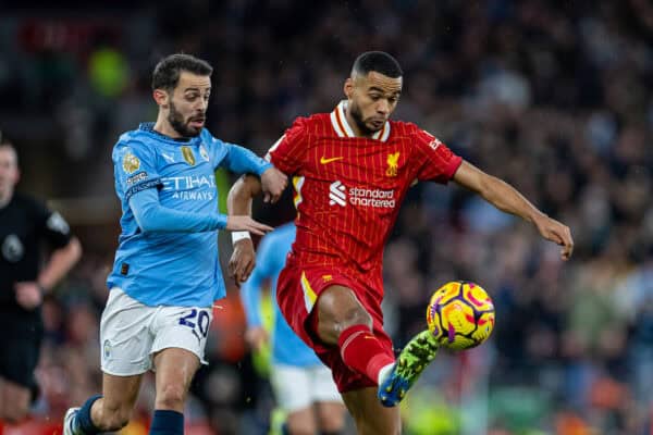 LIVERPOOL, ENGLAND - Sunday, December 1, 2024: Liverpool's Cody Gakpo (R) icb' Manchester City's Bernardo Silva during the FA Premier League match between Liverpool FC and Manchester City FC at Anfield. (Photo by David Rawcliffe/Propaganda)