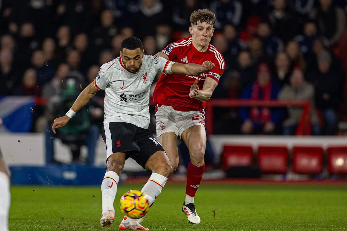 NOTTINGHAM, ENGLAND - Tuesday, December 14, 2025: Liverpool's Cody Gakpo shoots under pressure from Nottingham Forest's captain Ryan Yates during the FA Premier League match between Nottingham Forest FC and Liverpool FC at the City Ground. (Photo by David Rawcliffe/Propaganda)