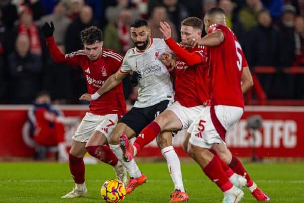 NOTTINGHAM, ENGLAND - Tuesday, January 14, 2025: Liverpool's Mohamed Salah is challenged by three Nottingham Forest players during the FA Premier League match between Nottingham Forest FC and Liverpool FC at the City Ground. (Photo by David Rawcliffe/Propaganda)