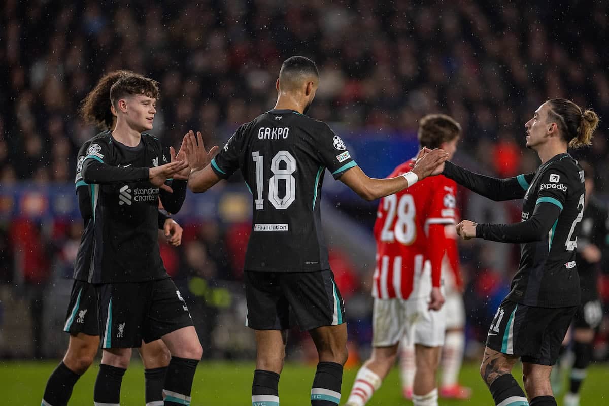 EINDHOVEN, NETHERLANDS - Wednesday, January 29, 2025: Liverpool's Cody Gakpo (C) celebrates after scoring the first goal with team-mates James McConnell (L) and Kostas Tsimikas (R) during the UEFA Champions League Matchday 8 game between PSV Eindhoven and Liverpool FC at the Philips Stadion. (Photo by David Rawcliffe/Propaganda)