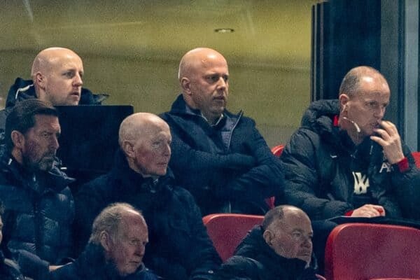 LIVERPOOL, ENGLAND - Wednesday, February 26, 2025: Liverpool's head coach Arne Slot (C) and first assistant coach Sipke Hulshoff (R) watch from the stands as they serve the first of a two match suspension during the FA Premier League match between Liverpool FC and Newcastle United FC at Anfield. (Photo by David Rawcliffe/Propaganda)