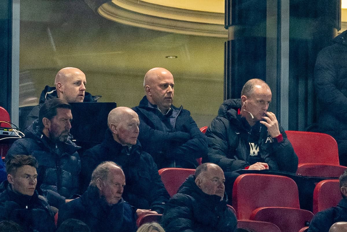 LIVERPOOL, ENGLAND - Wednesday, February 26, 2025: Liverpool's head coach Arne Slot (C) and first assistant coach Sipke Hulshoff (R) watch from the stands as they serve the first of a two match suspension during the FA Premier League match between Liverpool FC and Newcastle United FC at Anfield. (Photo by David Rawcliffe/Propaganda)