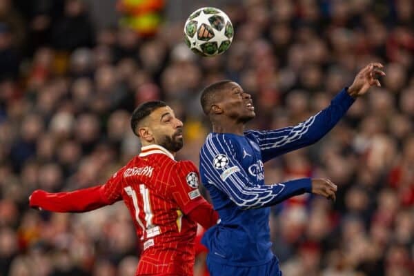 LIVERPOOL, ENGLAND - Tuesday, March 11, 2025: Liverpool's Mohamed Salah (L) is challenged by Paris Saint-Germain's Nuno Mendes during the UEFA Champions League Round of 16 2nd Leg match between Liverpool FC and Paris Saint-Germain FC at Anfield. (Photo by David Rawcliffe/Propaganda)