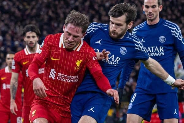 LIVERPOOL, ENGLAND - Tuesday, March 11, 2025: Liverpool's Alexis Mac Allister is challenged by Paris Saint-Germain's Khvicha Kvaratskhelia (R) during the UEFA Champions League Round of 16 2nd Leg match between Liverpool FC and Paris Saint-Germain FC at Anfield. (Photo by David Rawcliffe/Propaganda)