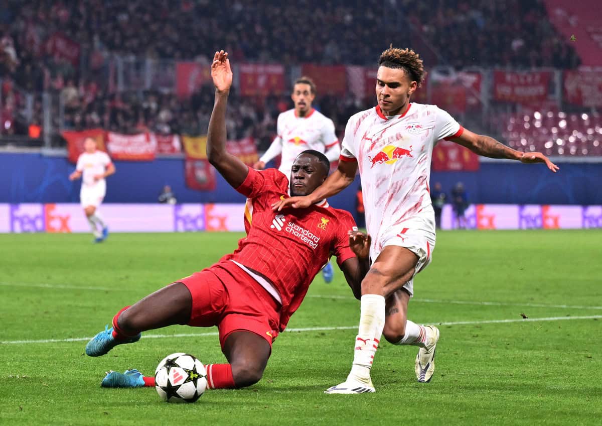 LEIPZIG, GERMANY - OCTOBER 23: Ibrahima Konate of Liverpool is challenged by Antonio Nusa of RB Leipzig during the UEFA Champions League 2024/25 League Phase MD3 match between RB Leipzig and Liverpool FC at Leipzig Stadium on October 23, 2024 in Leipzig, Germany. (Photo by Oliver Hardt - UEFA/UEFA via Getty Images)