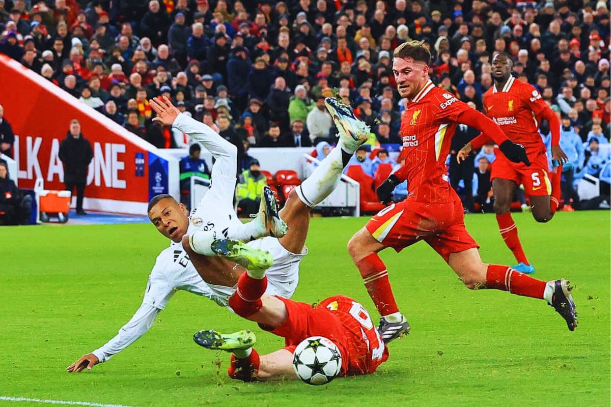 2YP03W0 Anfield, Liverpool, Merseyside, UK. 27th Nov, 2024. Champions League Football, Liverpool versus Real Madrid; Conor Bradley of Liverpool wins the ball from Kylian Mbappe of Real Madrid with a sliding tackle Credit: Action Plus Sports/Alamy Live News