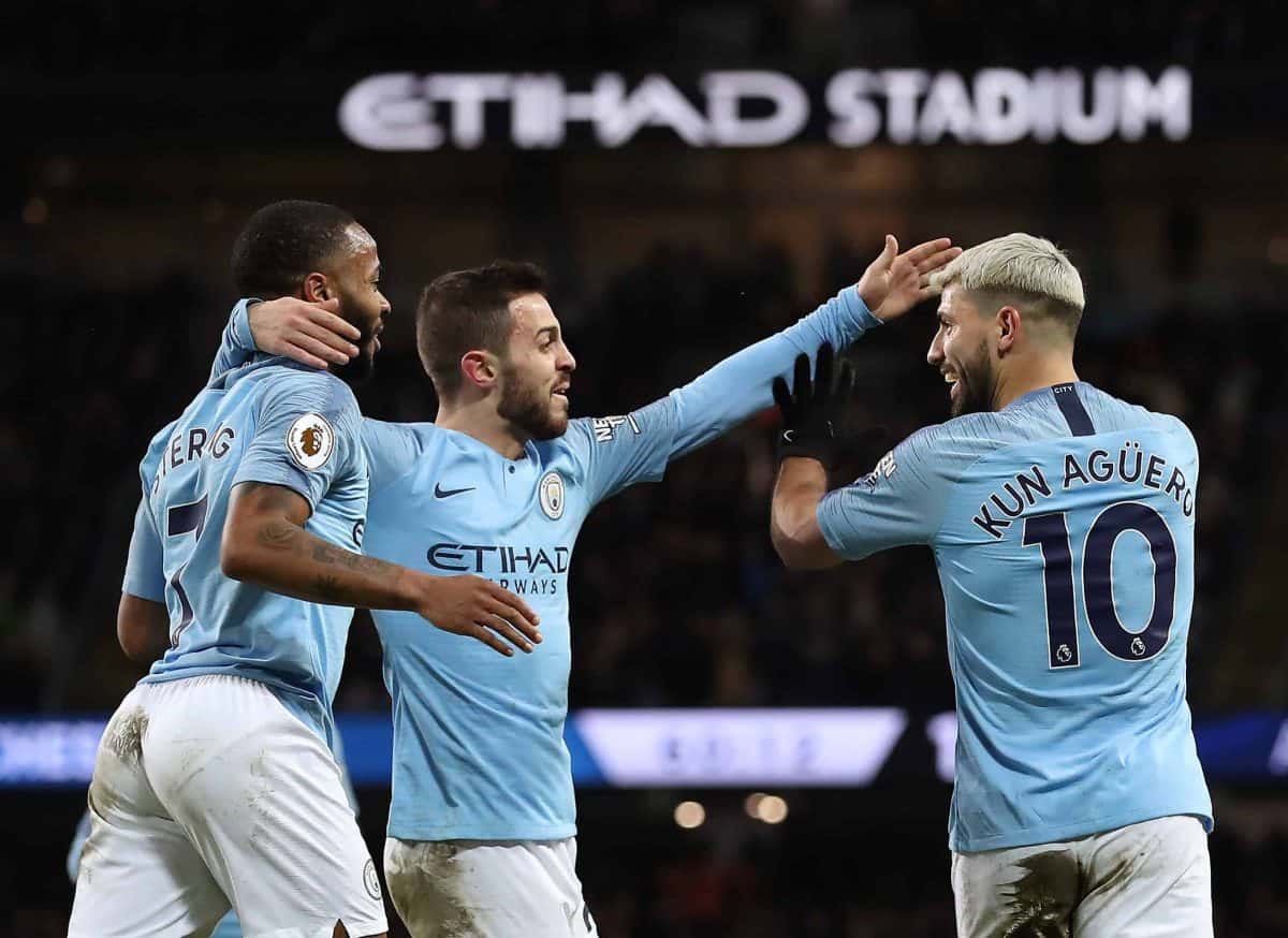 Manchester City's Sergio Aguero (right) celebrates scoring his side's third goal of the game with Raheem Sterling (left) and Mota Bernardo Silva during the Premier League match at the Etihad Stadium, Manchester.